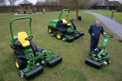 Paul Stevenson with the three new John Deere hybrid mowers