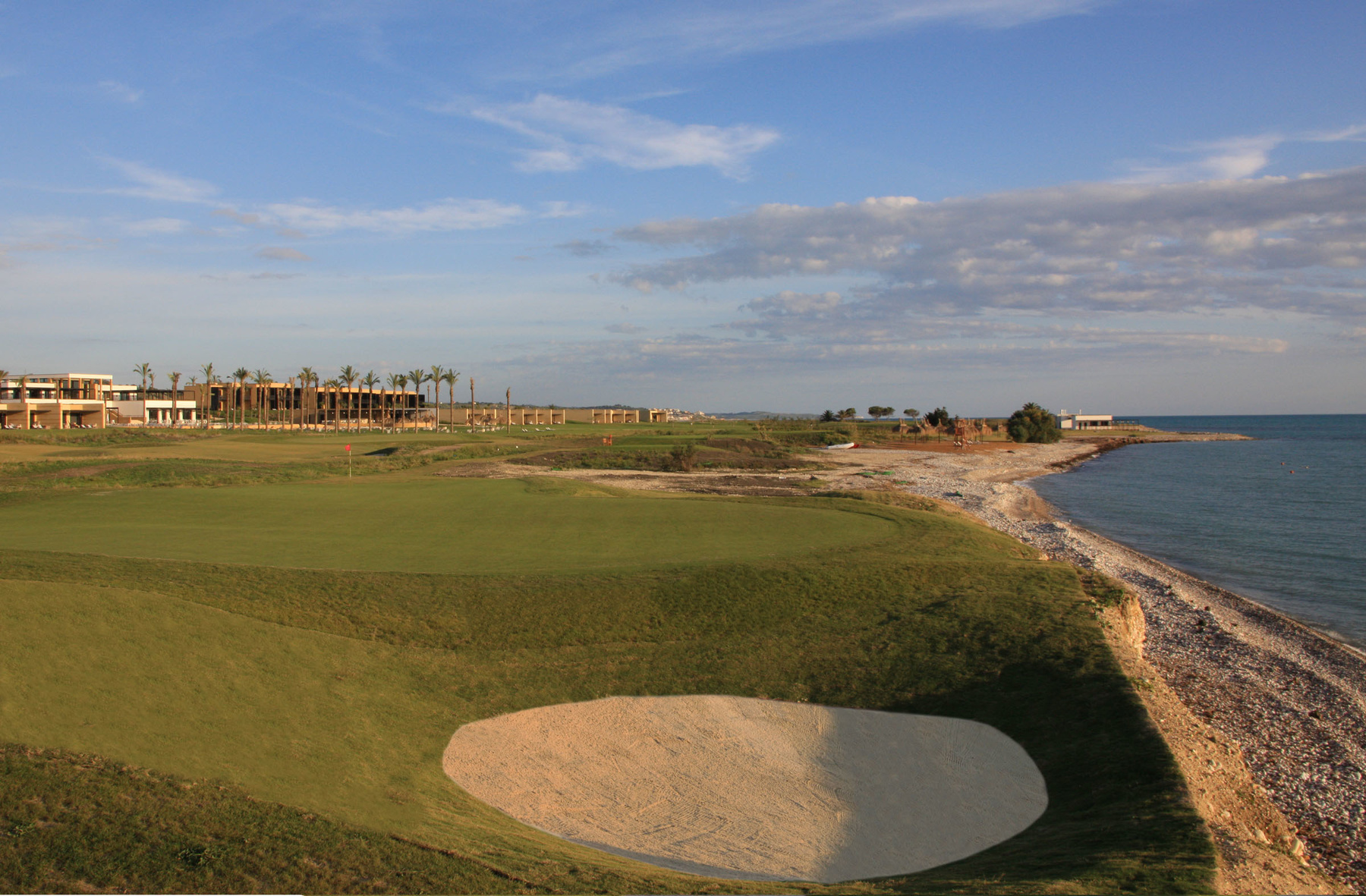 Verdura Golf and Spa Resort 17th green to tee & hotel