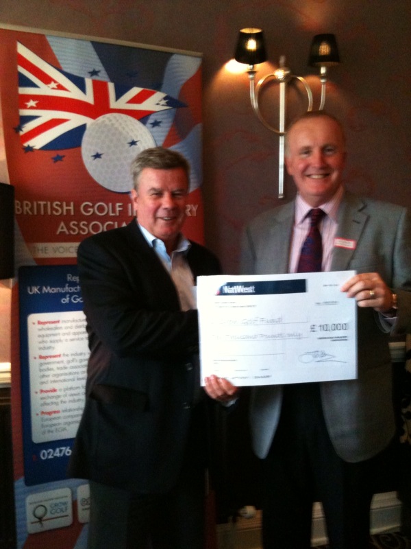 Doug Poole, BGIA Chairman, (right) presenting the BGIA Charity Golf Day cheque of £10,000 to the Grow Golf Chairman Bob Smith