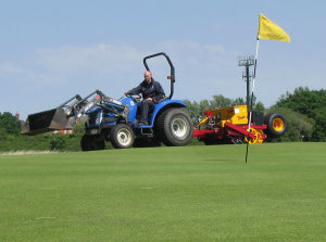 Links Manager, Craig Gilholm, overseeding a green at Royal Liverpool Golf Club