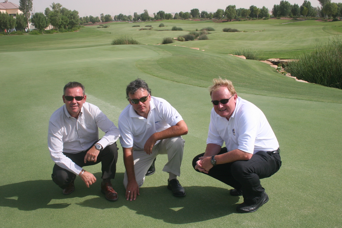 David Garland (centre) inspects the 18th green with agronomist Graeme MacNiven (right) and Geoff Hunter, General Manager of Jumeirah Golf Estates.