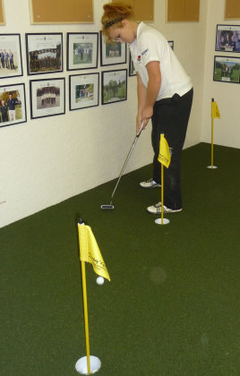 Pupil Sophie Keech on the Huxley Golf installation at Millfield School  