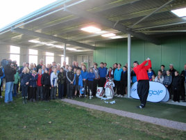 Watched by children from Auldearn, Cawdor, Millbank, Rosebank primary schools and Nairn Academy, Paul Lawrie strikes the first ball on Nairn Dunbar GC’s new practice facility (by Willie MacKay)