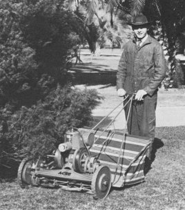 Co-founder Oscar Jacobsen tests one of the first Four Acre Mowers in 1921