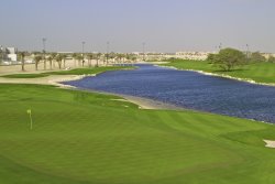 The Royal Golf Club’s Montgomerie Course 16th green looking across the lake to hole 15.