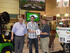 A plaque was presented to VGR owner Arwin Verschoor, by Randy Default, Sales Manager for Dakota Equipment and Richard Campey
