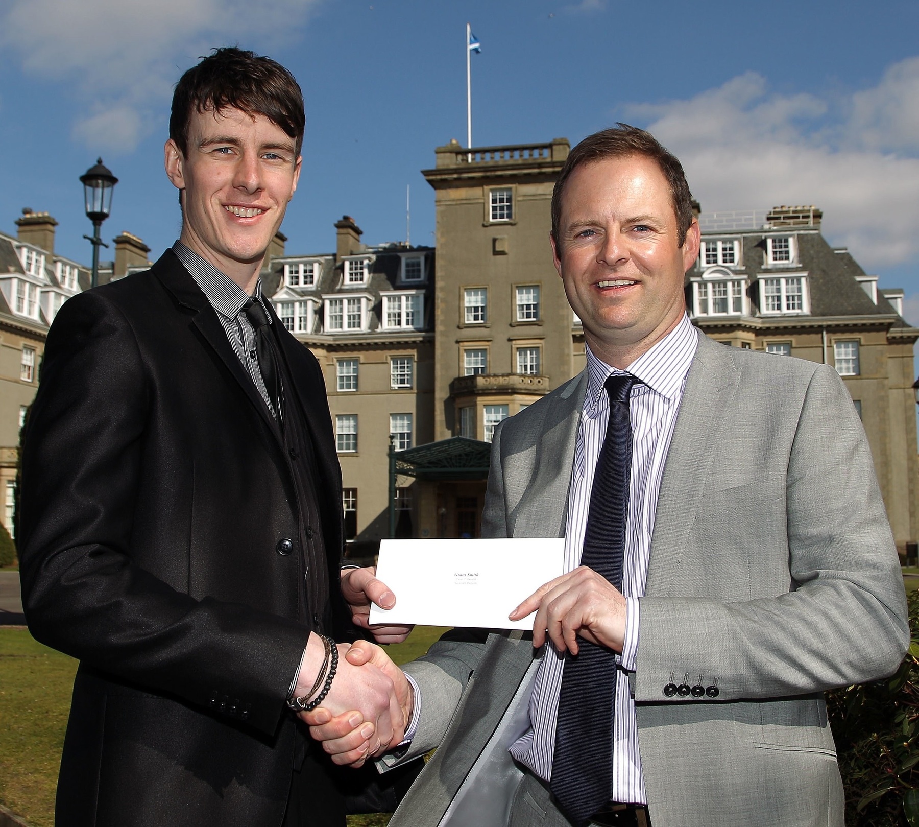 Grant Smith (left) of Gleneagles receives his award for the leading Year Three assistant Professional in theScottish Region from TGI Golf Chairman Ian Muir (right).