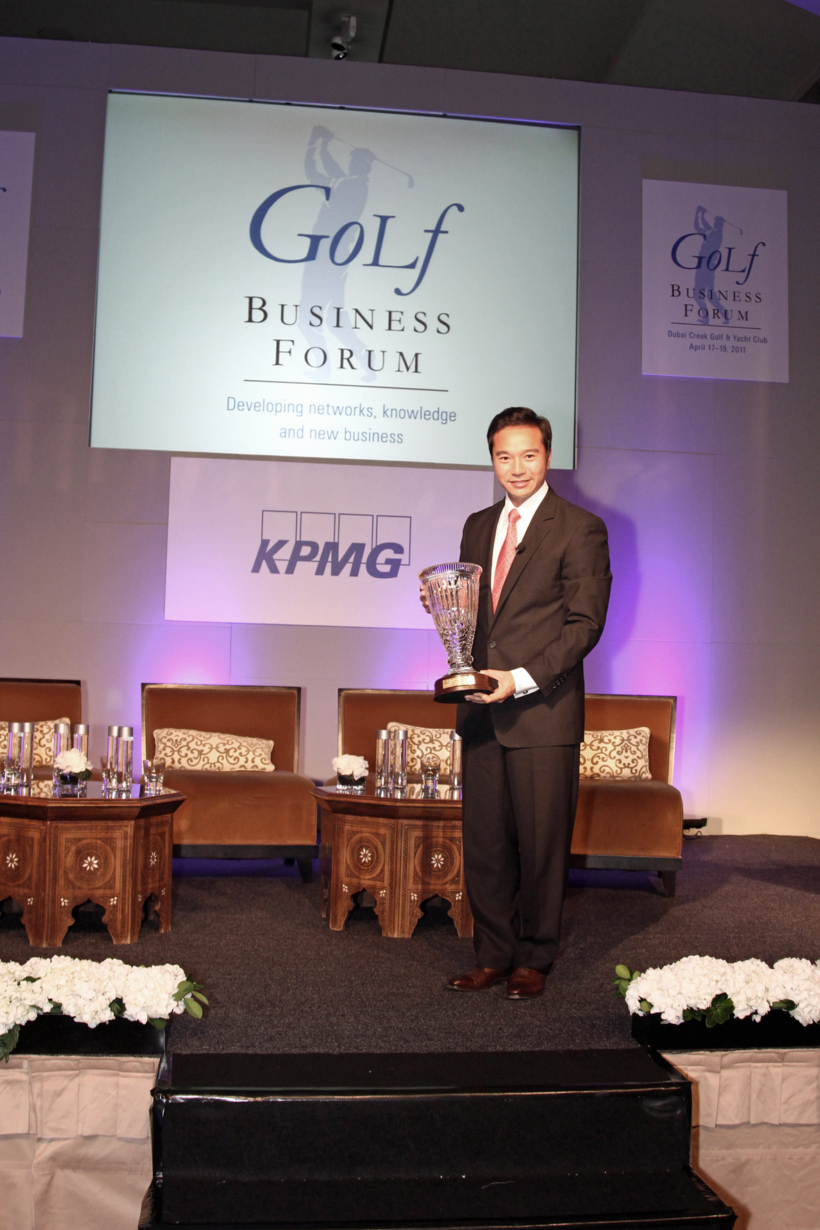 Tenniel Chu accepts the 2011 KPMG Lifetime Achievement Award on behalf of his father, Dr David Chu, Chairman of Mission Hills Group and Mission Hills Golf Club in China.