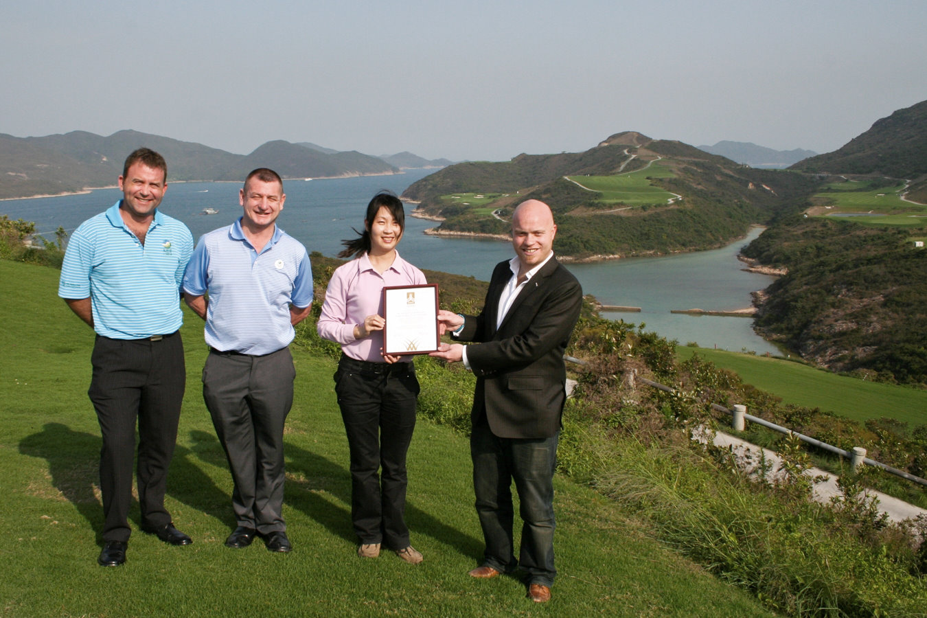 Kau Sai Chau management team receives the GEO Certified™ award. (Left to right:) Cameron Halliday, General Manager; Mike Carey, Head of Golf Operations; Christine Chan, Superintendent; Benjamin Warren, GEO Communications Director