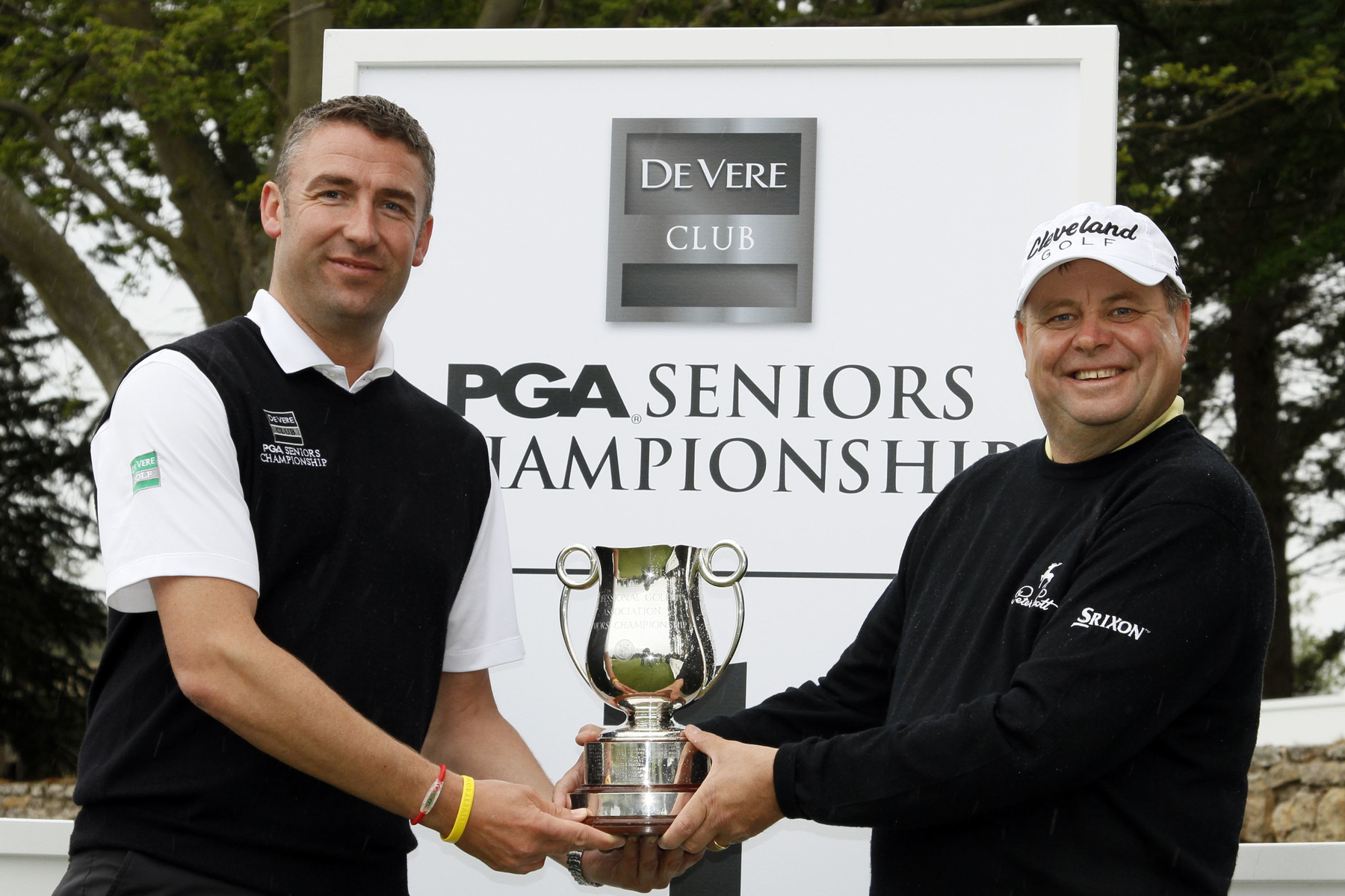 aniel Hodson Director of Golf & Leisure for De Vere presents trophy to Andrew Oldcorn