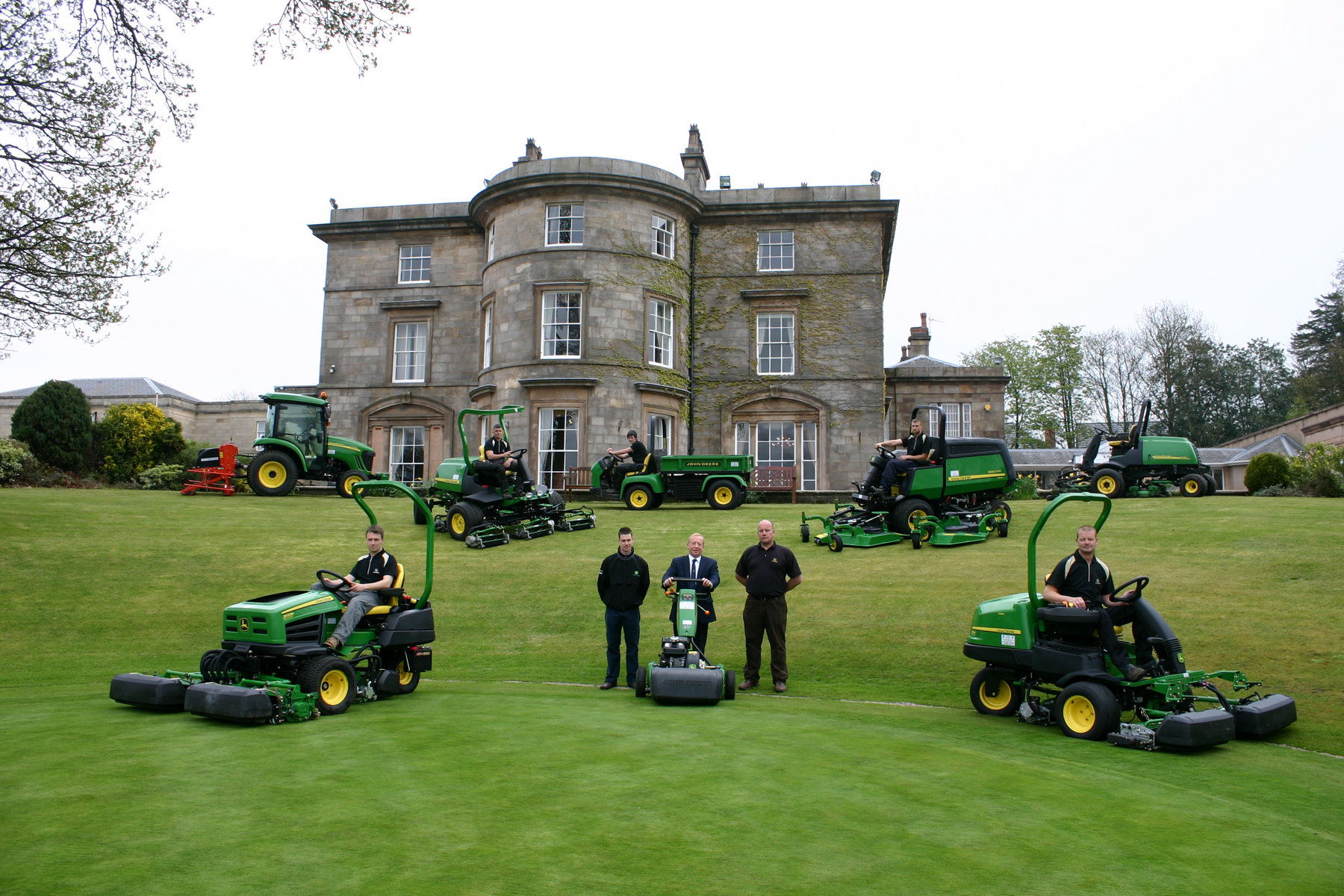 (Front left to right) Shaw Hill Golf Club deputy course manager Shaun Hutchinson, Balmers Garden Machinery golf & turf workshop manager Andrew Stoney, hotel golf coordinator Phil Powell, dealer salesman Darren Barker of Balmers and course manager Neil Hamlett, with the rest of the greens staff and the new John Deere fleet.