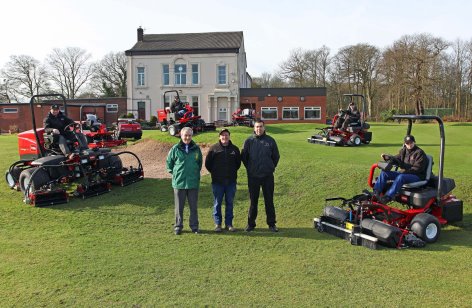 Front from left are Haydock Park’s David Hughes and Terry Wharton, Cheshire Turf Machinery’s Chris Halley, and the greenkeeping team looking on.