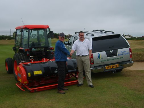 Paul Lappin, left, Course Manager at Kirkiston Castle CC,CountyDown, takes delivery of a Wiedenmann GXi8 HD from Kyle Irwin, Technical Sales  Representative, from dealer Turfcare