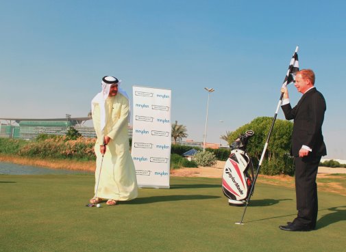 Meydan CEO Saeed Humaid Al Tayer putts with Troon's Bruce Glasco.