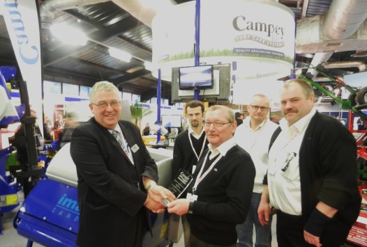 Richard Campey presents European award to Jens-Erik Hansen. From left to right in foreground: Richard Campey, Jens-Erik Hansen, Jens-Michael Petersen. Left to right in background is: Kristian deFine Licht and Jens Klocker Pedersen