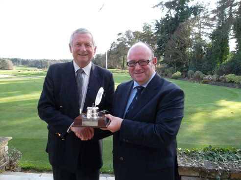 Golf Foundation Chairman Charles Harrison (left) congratulates Mike Harris of the AGW.