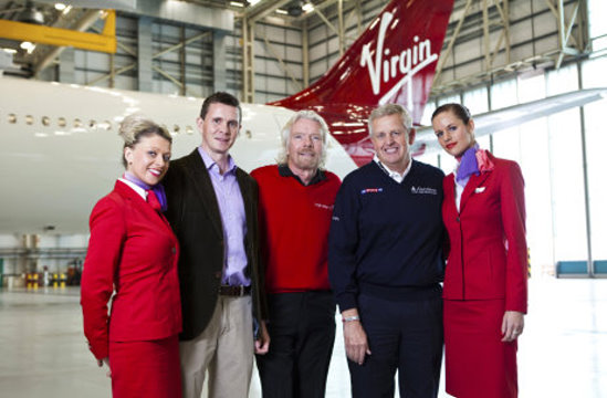 James Goode and Colin Montgomerie with members of the Virgin Atlantic team