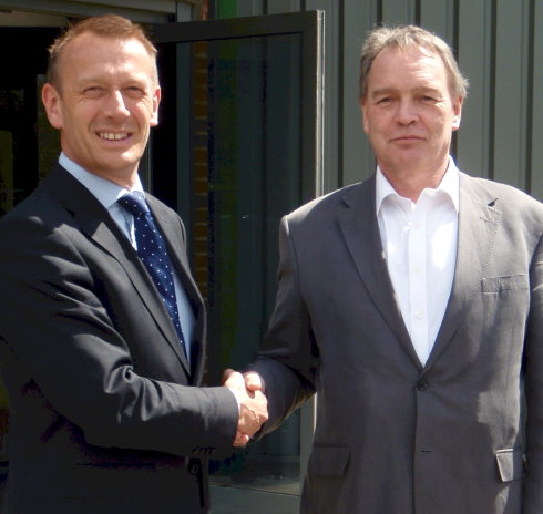 Austin Jarrett (left) and Christopher Harris following the signing of the agreement