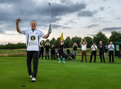 British Army Captain Stuart Ball has set a new unofficial world record of 432 golf holes played on foot in five days, to raise money for children who have lost parents in the forces.