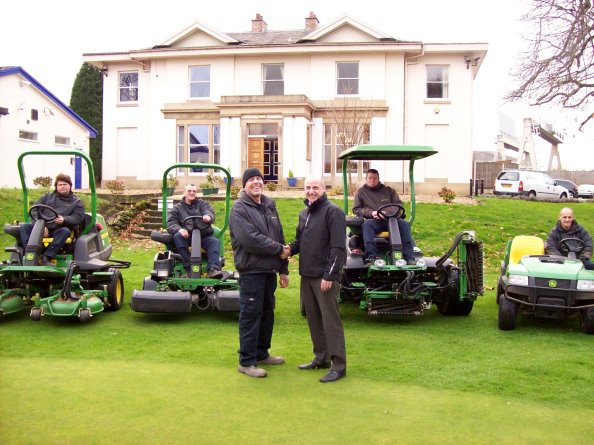 (Front l-r) Sale Golf Club course manager Chris Hulme with Kevin Pickering of Turner Groundscare, the greenkeeping team and their new John Deere machines (seated l-r): Kevin Brown, Harry Kent, Tom Hendly and Roy Whitby.