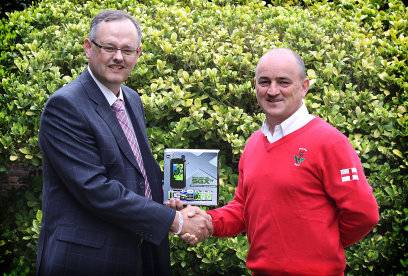 SkyCaddie's Nick Harvey (Left) presents a wireless SkyCaddie SGXW to Nigel Edwards, England Golf Director of Coaching