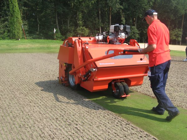 New Wiedenmann Core Recycler lifting hollow cores from a green