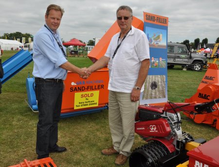 GKB Sandfiller sold at Saltex to Peter Knight, right, of Bury Turfcare, on the BLEC stand with GKB's Jan-Willem Kraaijeveld