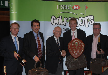 The European Tour’s Hugh Wickham presents the Wickham Shield to Team Wembley captain Heath Harvey after their excellent win