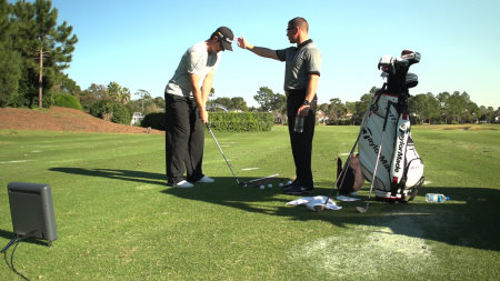 Justin Rose and coach Sean Foley using TrackMan during a coaching session.