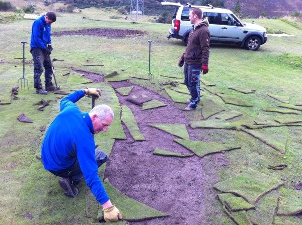 Eoin Riddell (Royal Dornoch Course Manager) fitting final pieces in the last green