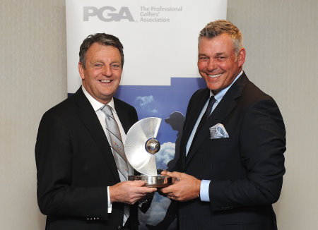 Darren Clarke receiving the PGA Recognition Award from PGA Captain Eddie Bullock (courtesy of Tom Dulate, Getty Images)