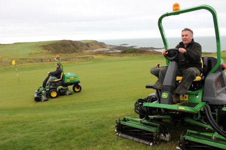 Nefyn’s course manager Pat McAteer (foreground) and first assistant Raymond Griffiths on two of the club’s new John Deere mowers now covered by PowerGard.