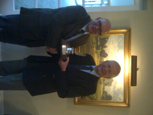 Mike Harris of the AGW (left) congratulates Golf Foundation Chairman Charles Harrison