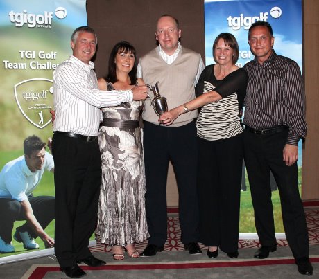  Chris Gray (left) and his team - Carol Gray, Andy Woodhead and Maxine Woodhead - are presented with their trophy by Giles Birkhead, TMaG Regional Sales Manager (centre)