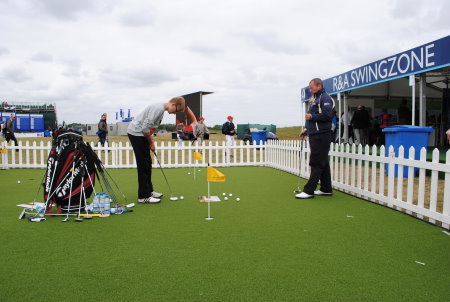 Fans receive expert tuition on the Huxley Golf putting green at last year’s Open Championship