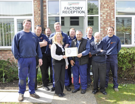 Gemma Cosby with Ransomes Jacobsen’s health and safety committee and
the company’s gold award certificate