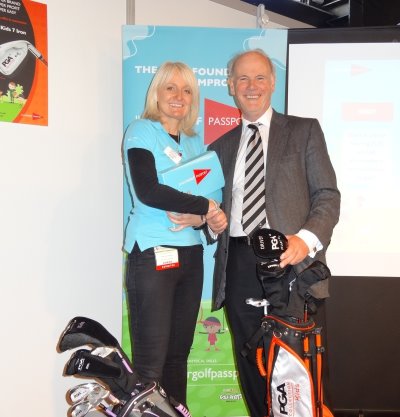 Sarah Tennyson, the Golf Foundation's project leader of the Junior Golf Passport, welcomes to the stand Sandy Jones, chief executive of the PGA, which endorses the scheme