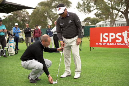 PGA Professional Craig Thomas (left) coaching KJ Choi
