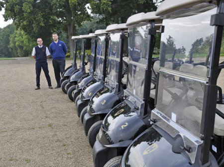 Andy Goodland (in blue jumper) and Ernest Doe’s Paul Scarfe at the handover of the fleet of E-Z-GO RXV golf cars at Hever Castle Golf Club