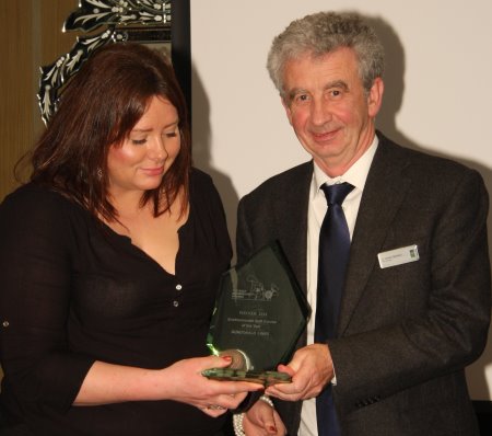 Amanda Dorans from Dundonald Links receiving award from Gordon McKillop, CEO, STRI