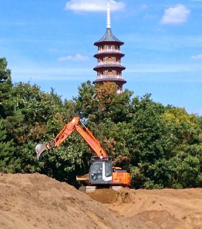Shaping of mounds on the golf course close to the Great Pagoda, located within the adjacent Royal Botanic Gardens, Kew
