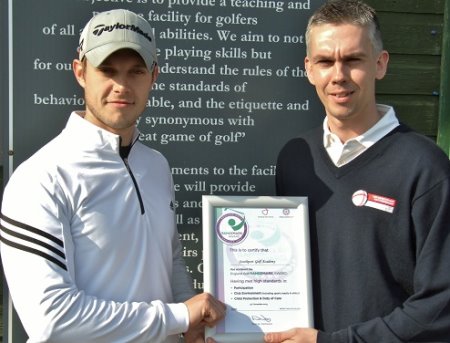 James Carpenter, left, is presented with the certificate by Iain Lancaster 