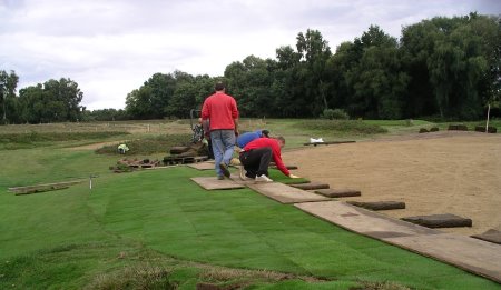 Speedcut Contractors power harrowing a tee at Reigate Heath Golf Club before laser levelling