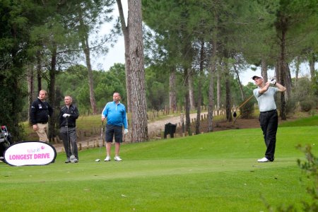 The victorious Team Waugh look on as Roger Jones tees off during the TGI Golf Team Challenge at Cornelia Golf Club, Belek, Turkey