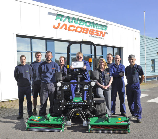 Safety representative Eddie Talbott with the RoSPA award (seated) flanked by Gemma Cosby, Ransomes Jacobsen’s EHS Manager (centre right), and other members of the safety team