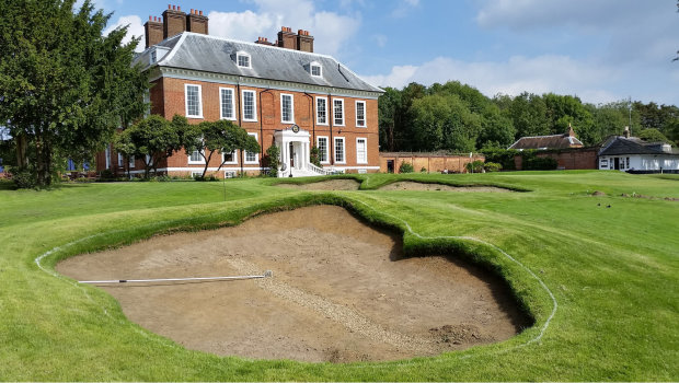 New approach bunker and remodelled greenside bunker at Royal Blackheath's 18th hole, with the Grade 2 Listed clubhouse in the background (photo: Ken Moodie / Creative Golf Design)