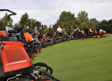 Vic Maynard (in white shirt) of Ernest Doe & Sons with the greenkeepiing team following the handover of the new fleet