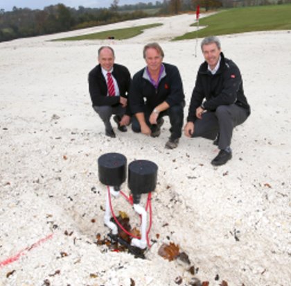 Tim Edwards, centre, with Lely’s Jeff Anguige, left, and The Toro Company’s Andrew Brown