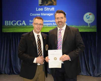 Lee (right) is presented with his certificate by CGSA President Christian Pilon