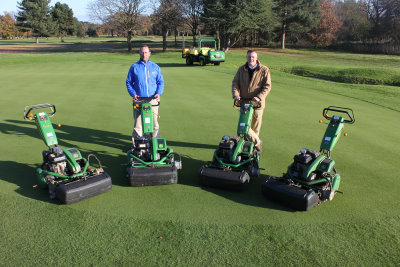 Royal Mid-Surrey Golf Club course manager Gavin Kinsella and Godfreys Golf & Turf dealer salesman Dave Searles with the new John Deere 220E hybrid walk-behind greens mowers